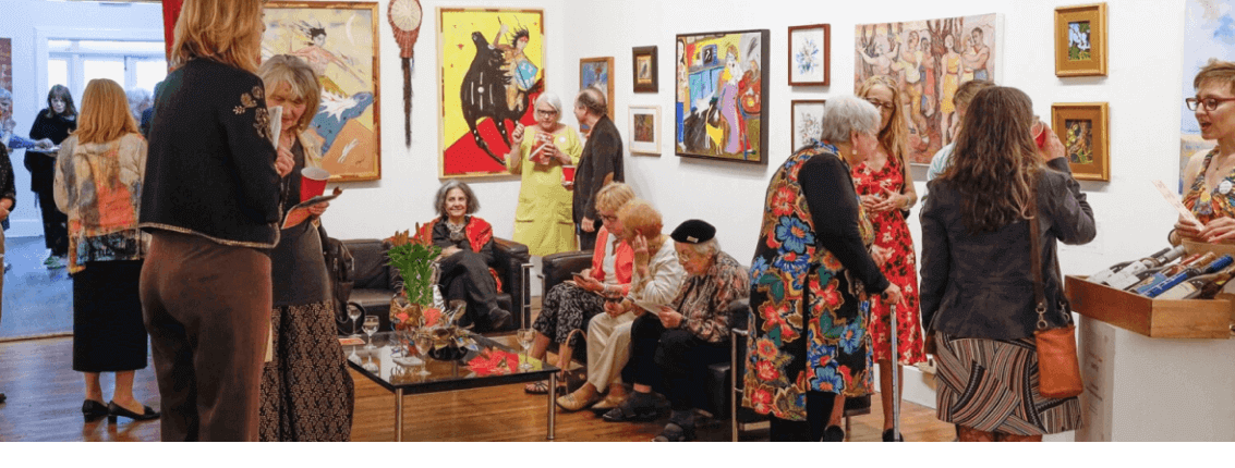 ASK's member's gallery during an opening reception, artists and art enthusiasts are conversing
